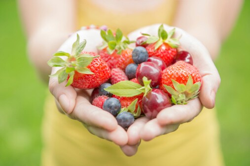 Girl holding fruits Girl holding fruits