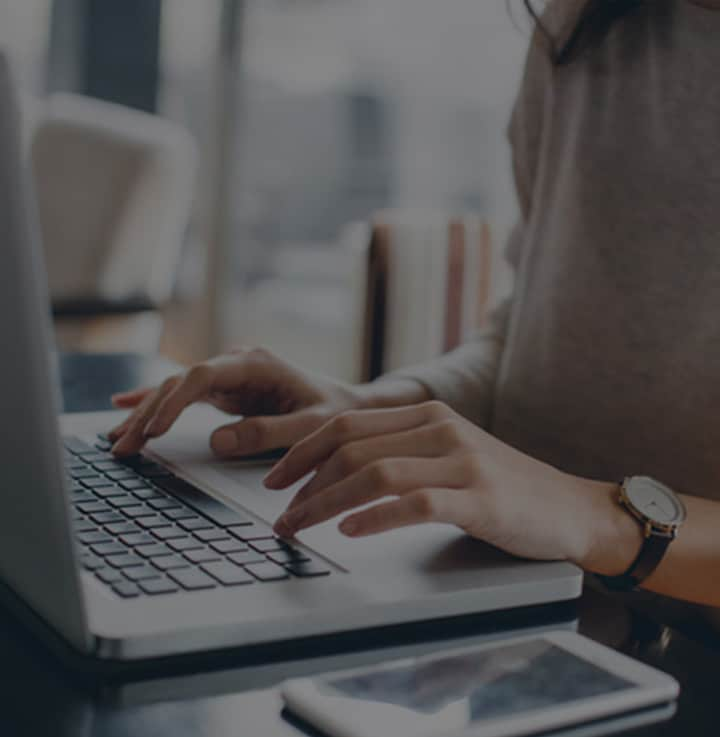 Woman typing on her computer