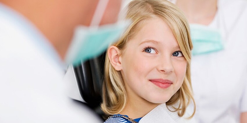 little girl at dentist