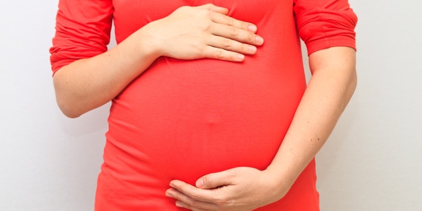 pregnant lady holding belly